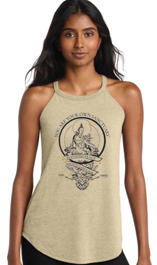 Woman wearing a green tank top with a graphic design on a white background